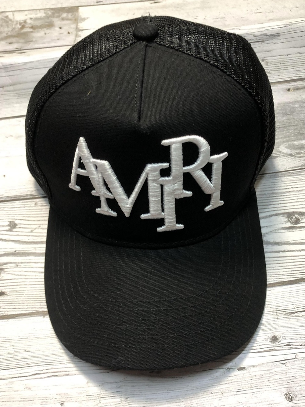 Amiri Staggered Logo Trucker Hat